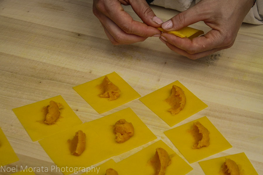 Wrapping the filling and dough into tortellino