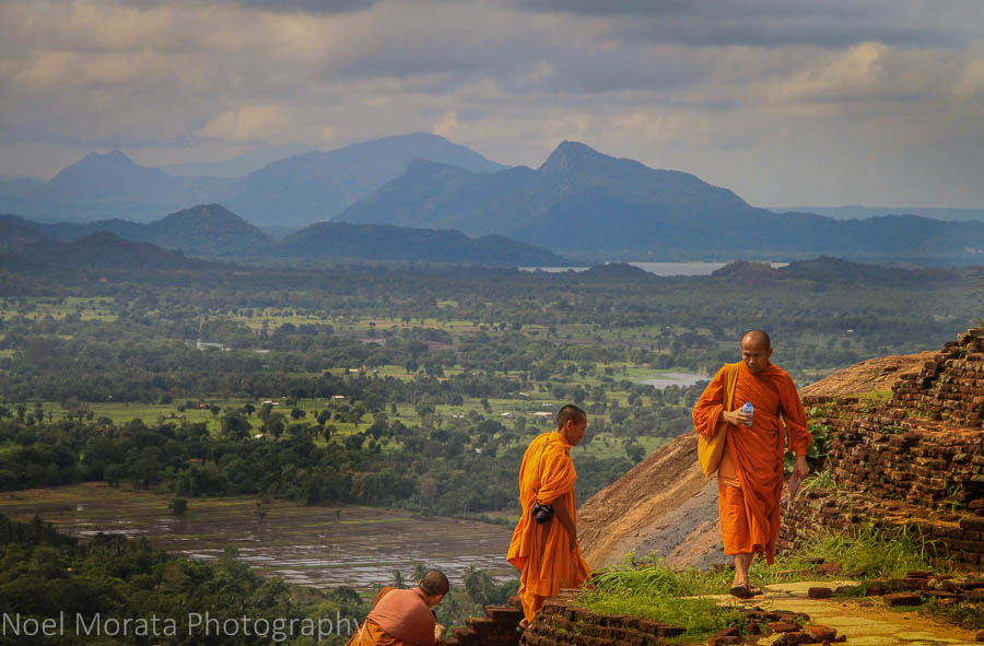 Monks climbing the ruins at Sigiriya in the Golden Triangle