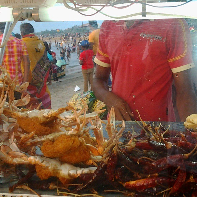 Crabs and fried foods at a beach stand in Negombo, Sri Lanka