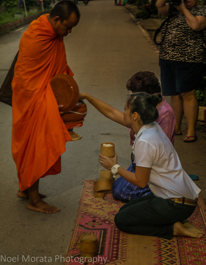 Alms offering at a temple in Chiang Khan