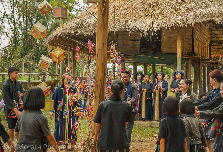 Traditional dance around a harvest pole at Tai Dam Village