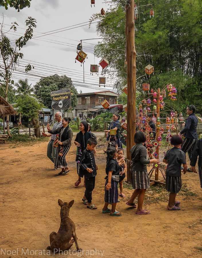 Dance around a maypole at the Ta Dam cultural village