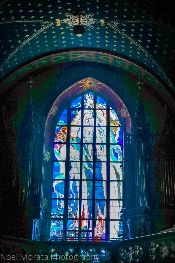 A lit up stained glass panel at a monastery in Krakow