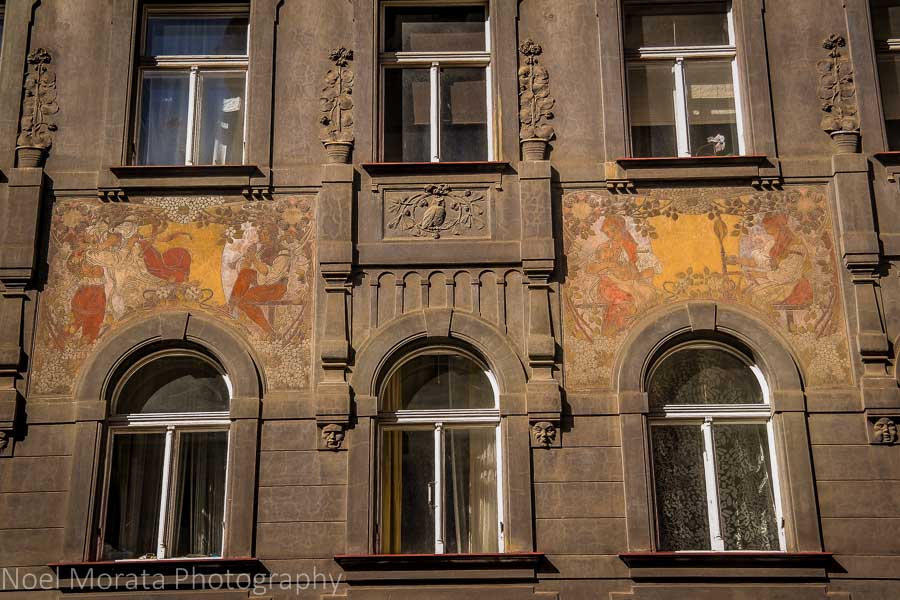 Painted façade detail in Prague's historic central district
