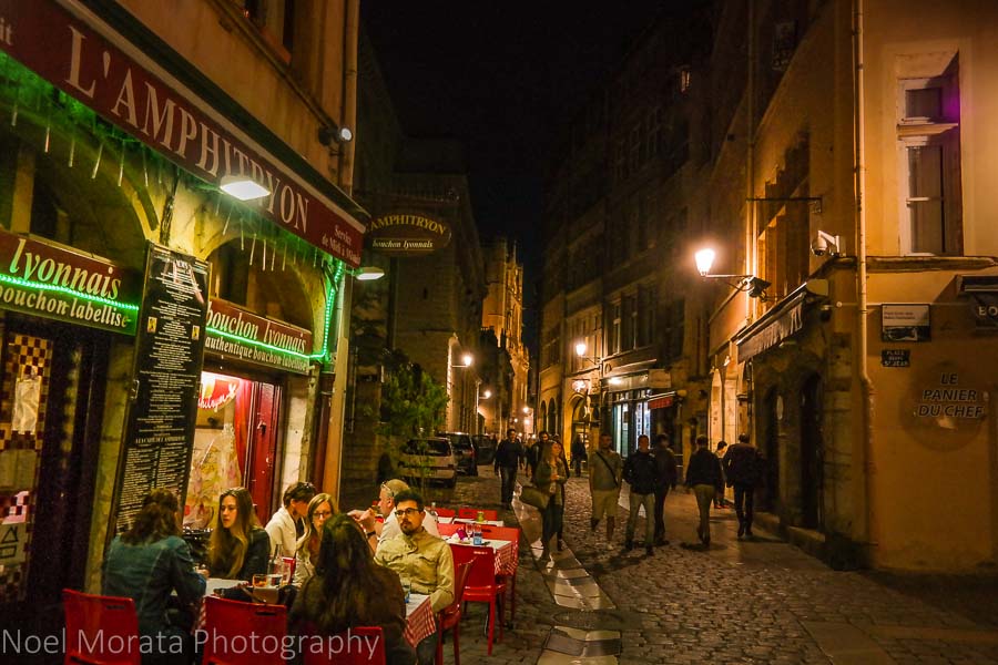 A busy promenade at night in Lyon, France 