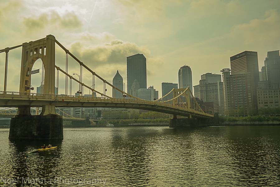 Iconic yellow suspension bridge and downtown PIttsburgh