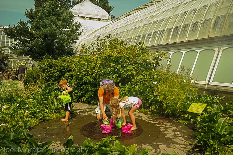 Watering the gardens at Phipps conservatory tour