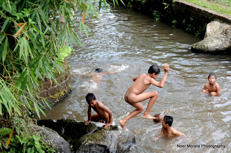 Playing in the stream by the Bali Eco retreat