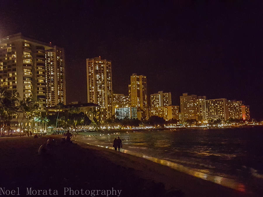 Waikiki beach and city scape at night time