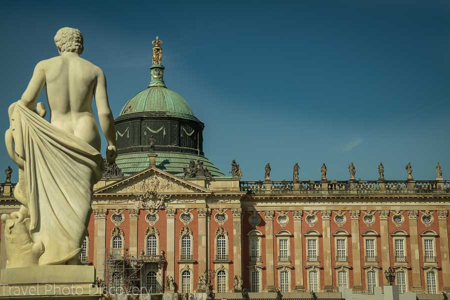 Statue and building façade of the Neues Palais or New Palace at Potsdam, Germany