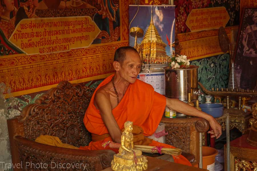 Monk in a shrine Visiting Wat Phra That Doi Suthep