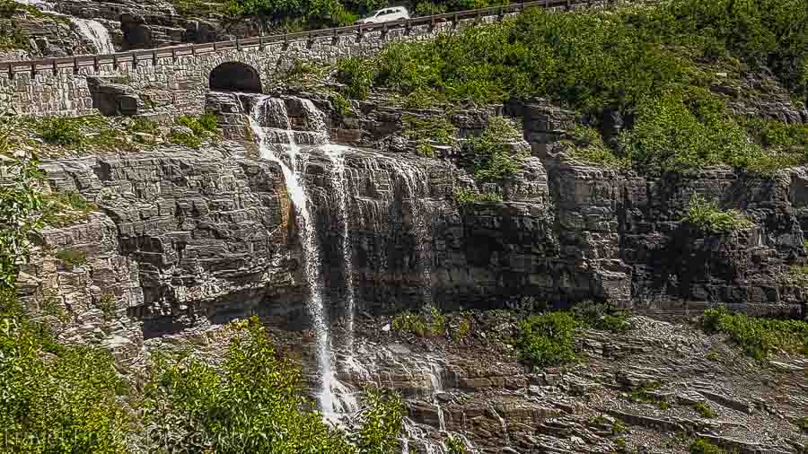 Driving across a waterfall at Glacier National Park