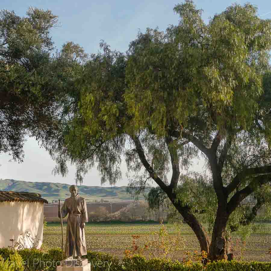 Father Serra and vineyards at Mission San Juan Bautista