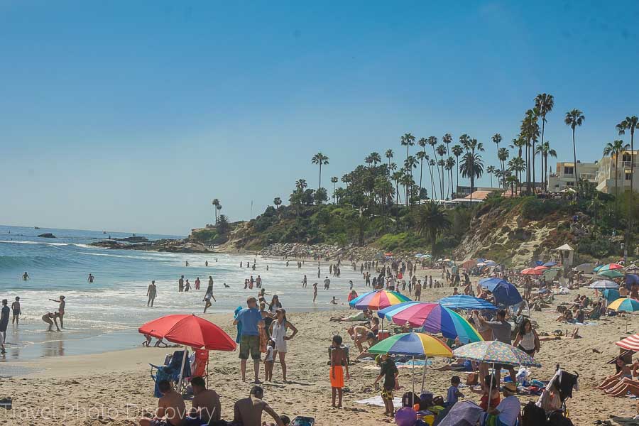 Exploring Laguna Beach coastline and crowded beach