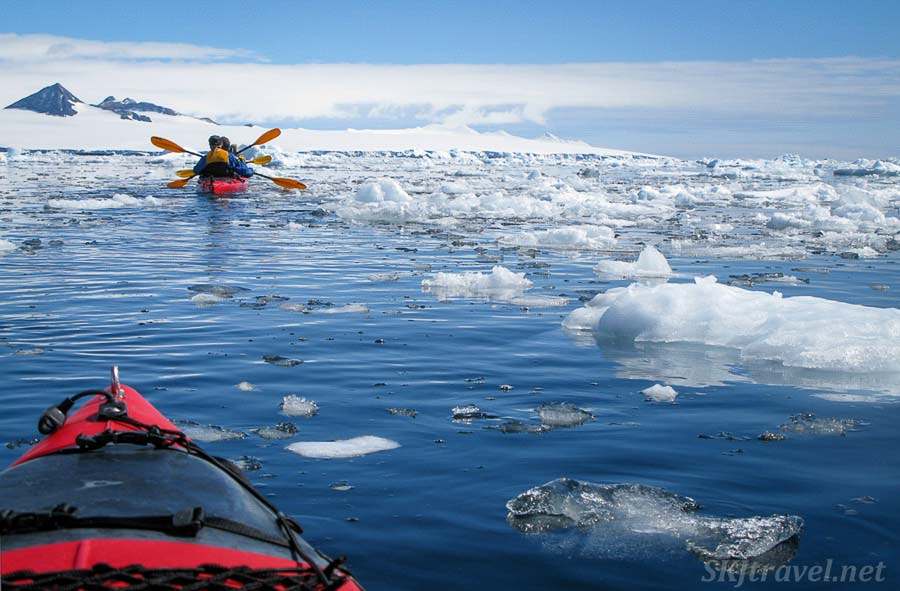 Kayaking around icebergs in Antarctica