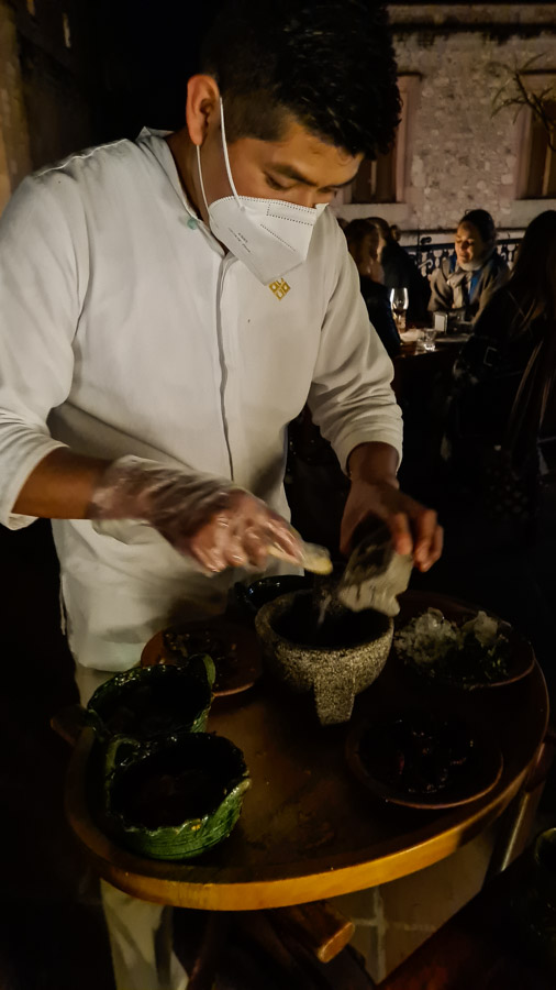 Making fresh salsa table side in oaxaca