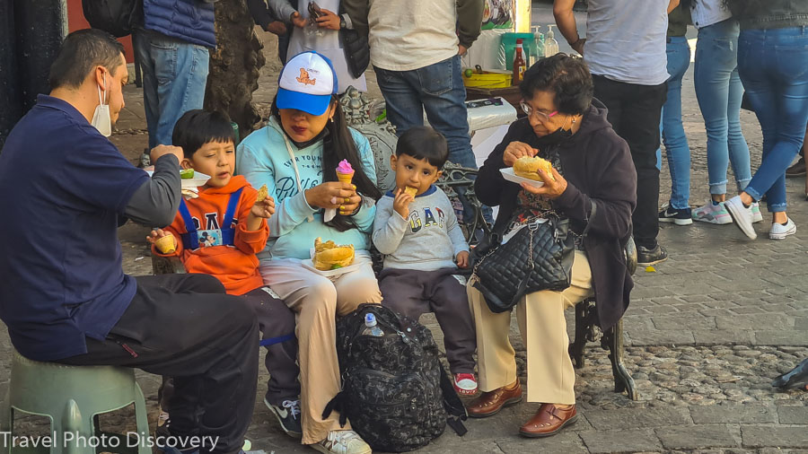 Enjoying a tasty and spicy torta sandwich at plaza de los Angeles and some people watching