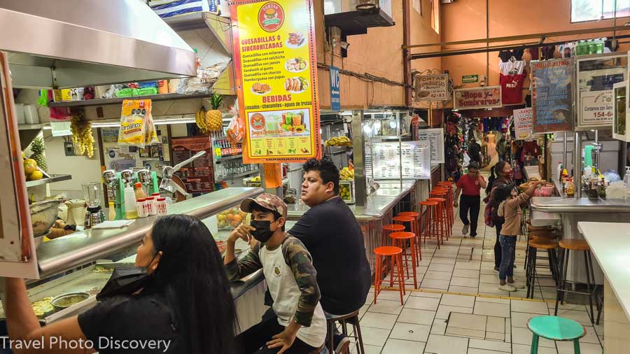 Enjoying the delicious local street food vendors in the public markets and outdoor streets around San Miguel