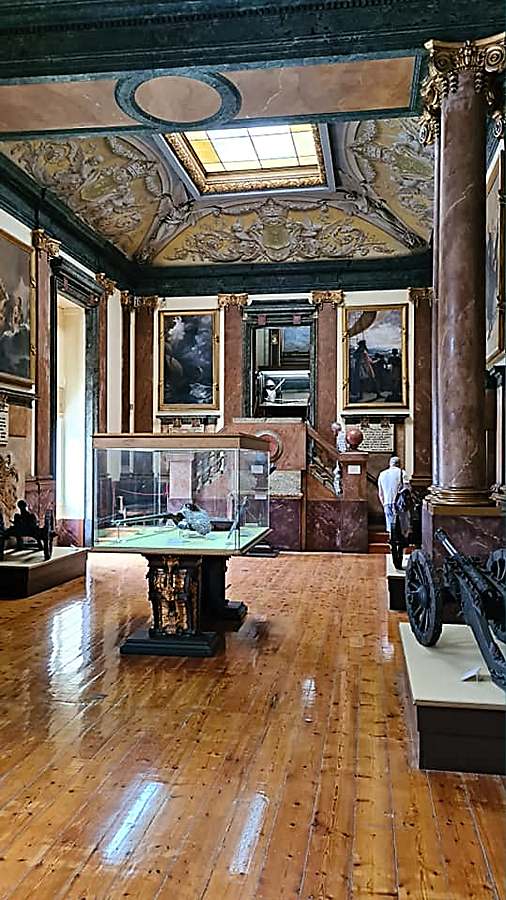 Ornate rooms with beautiful collections of military regalia and armaments