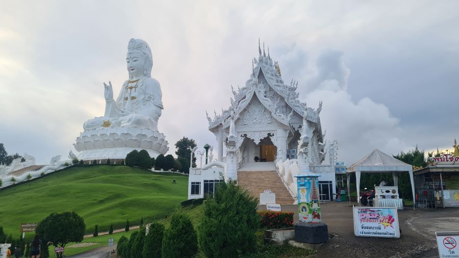 Wat Rong Khun (The White Temple) and quan yin statue
